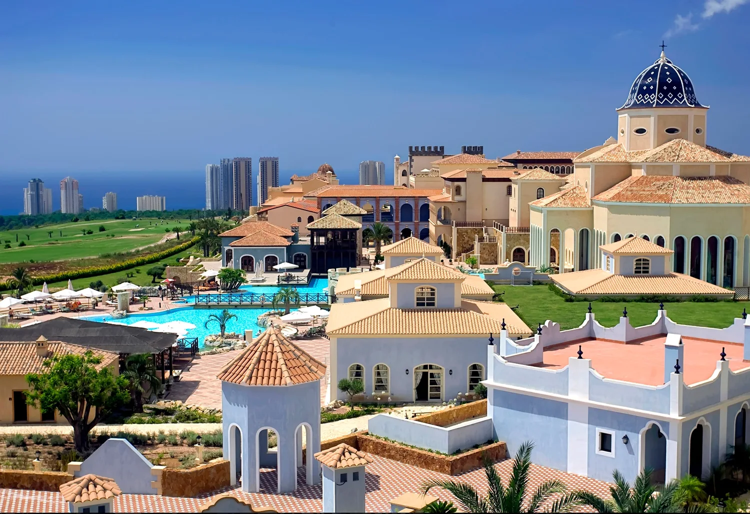 Meliá Villaitana Golf Resort · Resort pools and village-style buildings
